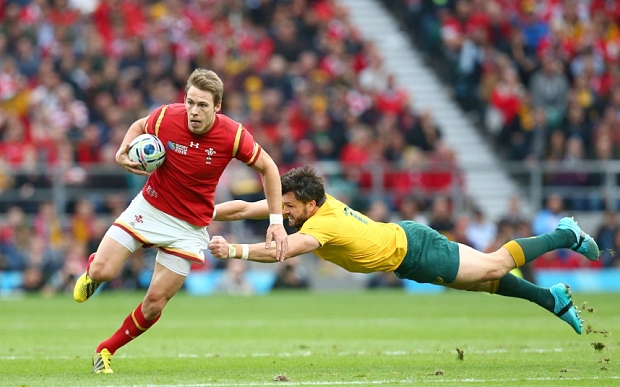 Mandatory Credit: Photo by Matthew Impey/REX Shutterstock (5226365aq) Liam Williams of Wales gets away from the diving Adam Ashley-Cooper of Australia. Australia v Wales, Rugby World Cup, Rugby Union, Twickenham, Britain - 10/10/2015